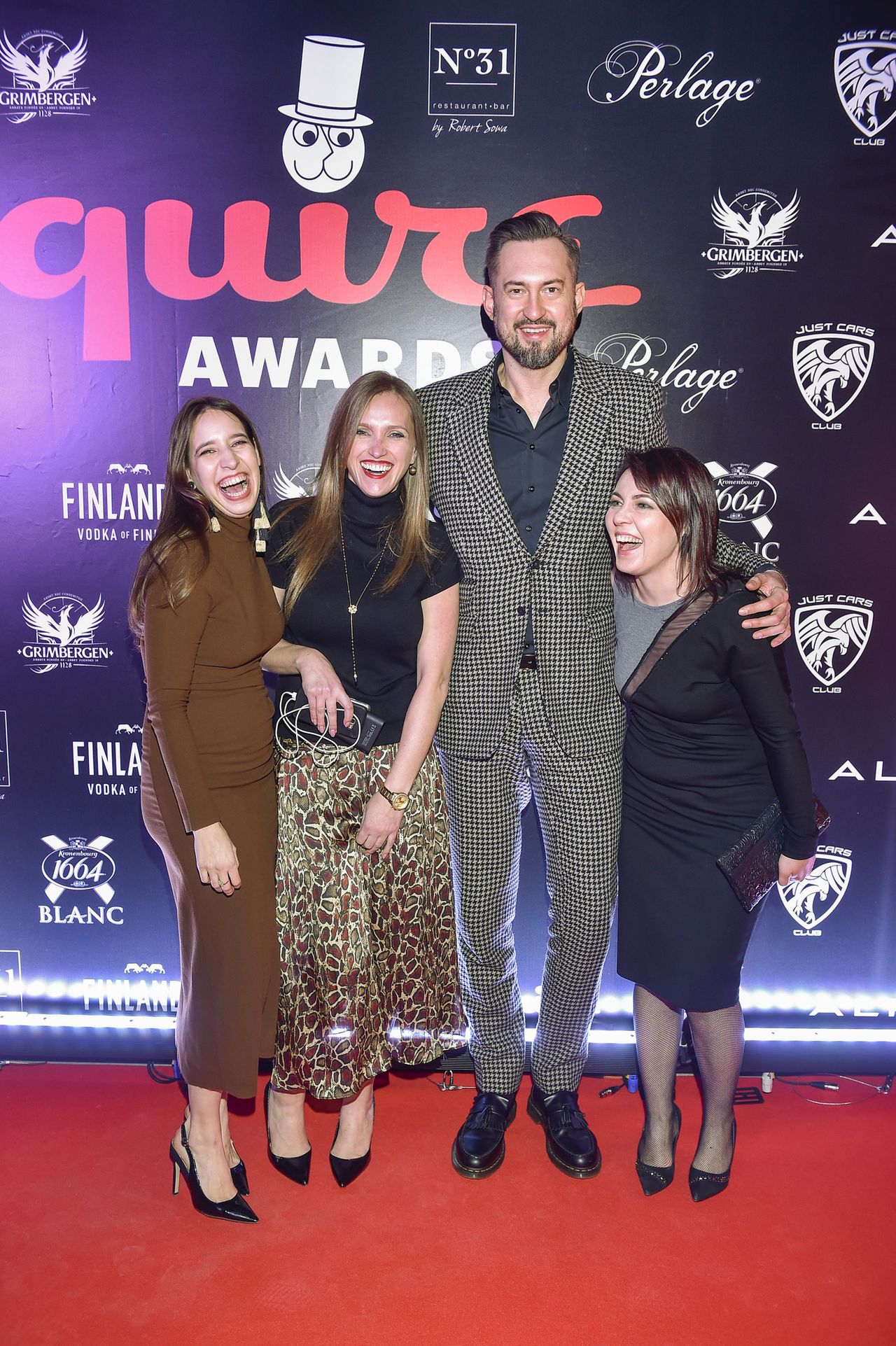 Tomasz Kot, Marcin Prokop, Kuba Przygoński ze statuetkami Esquire Awards