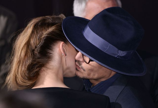 Zakochani Johnny Depp i Amber Heard całują się na ściance 