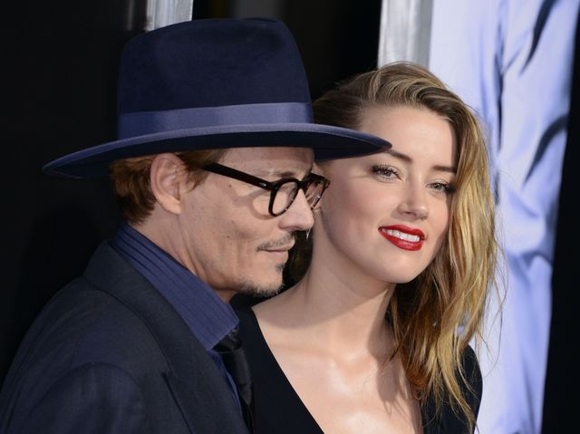 Zakochani Johnny Depp i Amber Heard całują się na ściance 