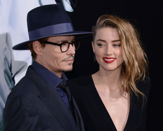 Zakochani Johnny Depp i Amber Heard całują się na ściance 