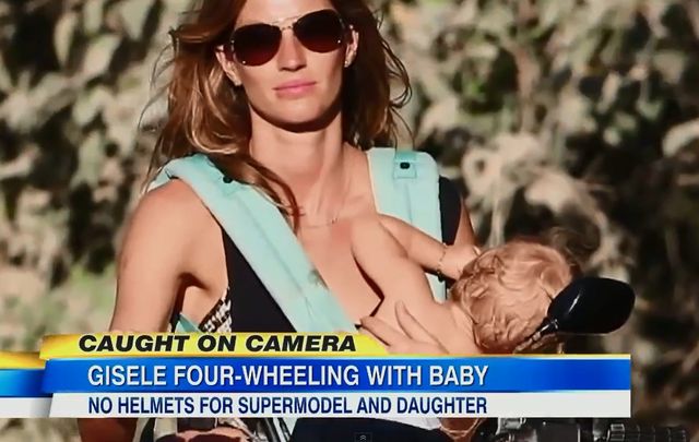 Gisele Bundchen, w jednej ręce dziecko, w drugiej kierownica