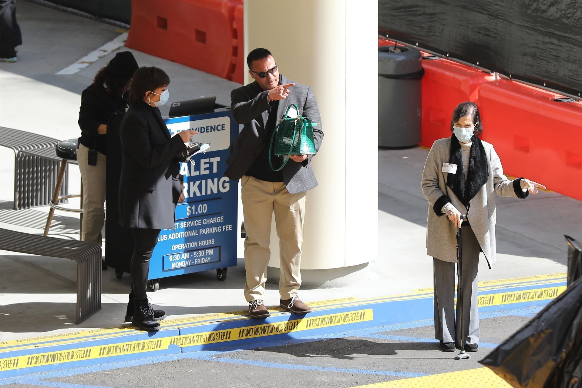 *EXCLUSIVE* Kris Jenner sports a surgical mask as she leaves the Providence Emergency Hospital with her mother