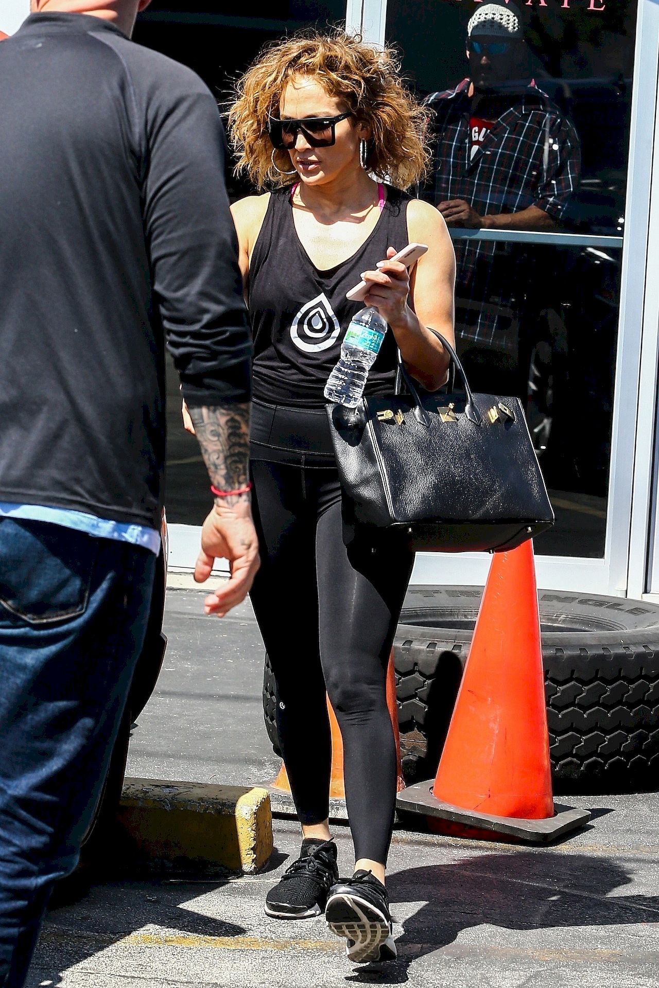 *EXCLUSIVE* Jennifer Lopez sports a curly new hairstyle while leaving the gym Jennifer Lopez