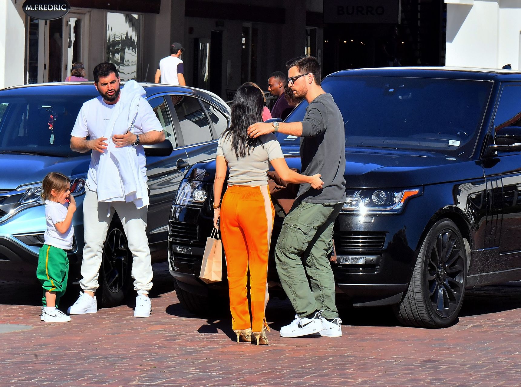 Kourtney Kardashian meets up with ex Scott Disick to drop off daughter Reign in Malibu, CA.