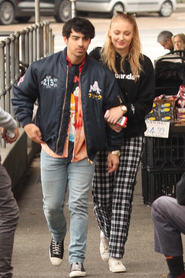 EXCLUSIVE: Joe Jonas and Sophie Turner share a kiss as they leave a Bondi cafe