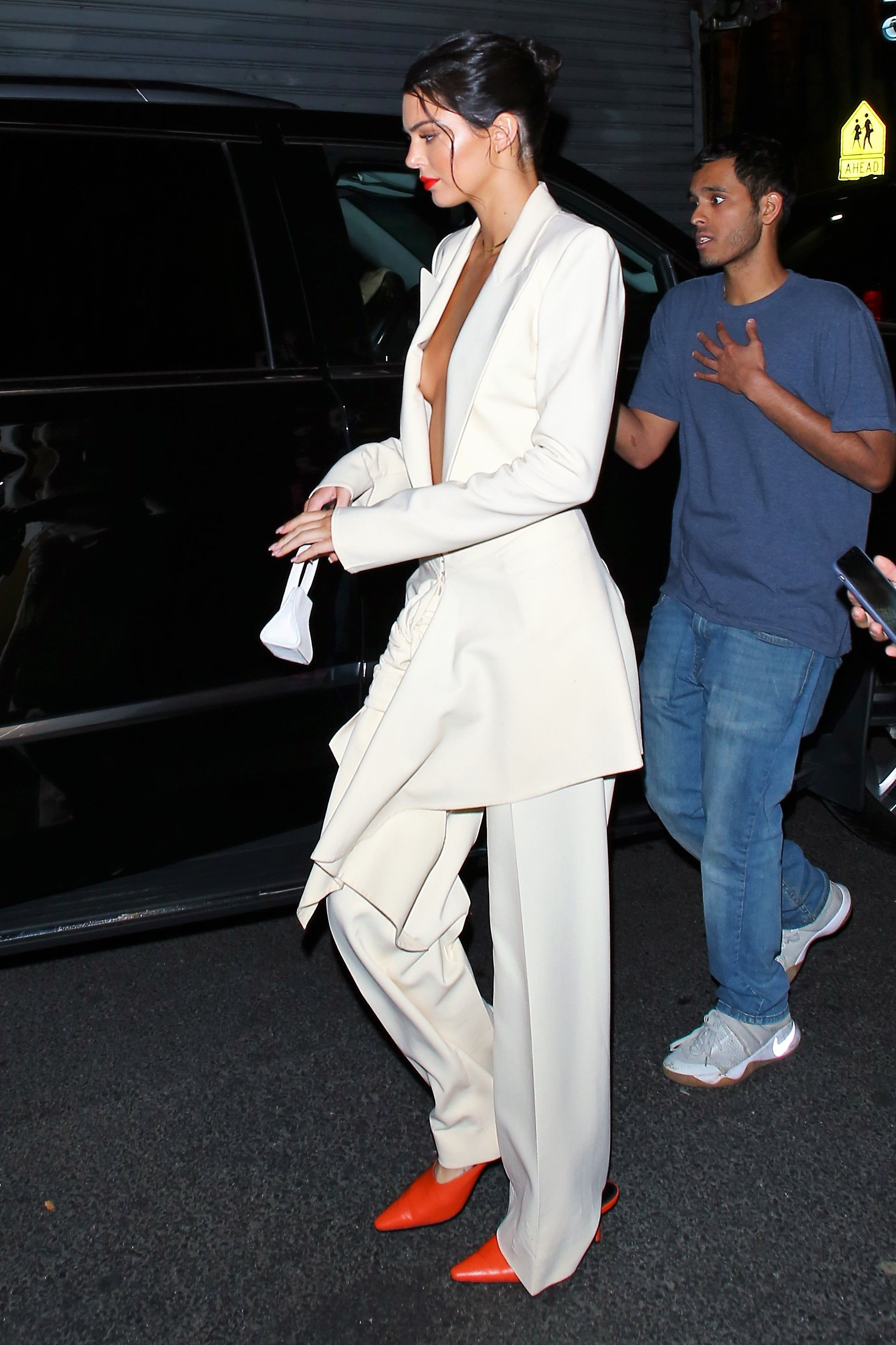 Kim Kardashian Is Striking In Yellow For Family Dinner With Kendall, Kylie, And Mom Kris