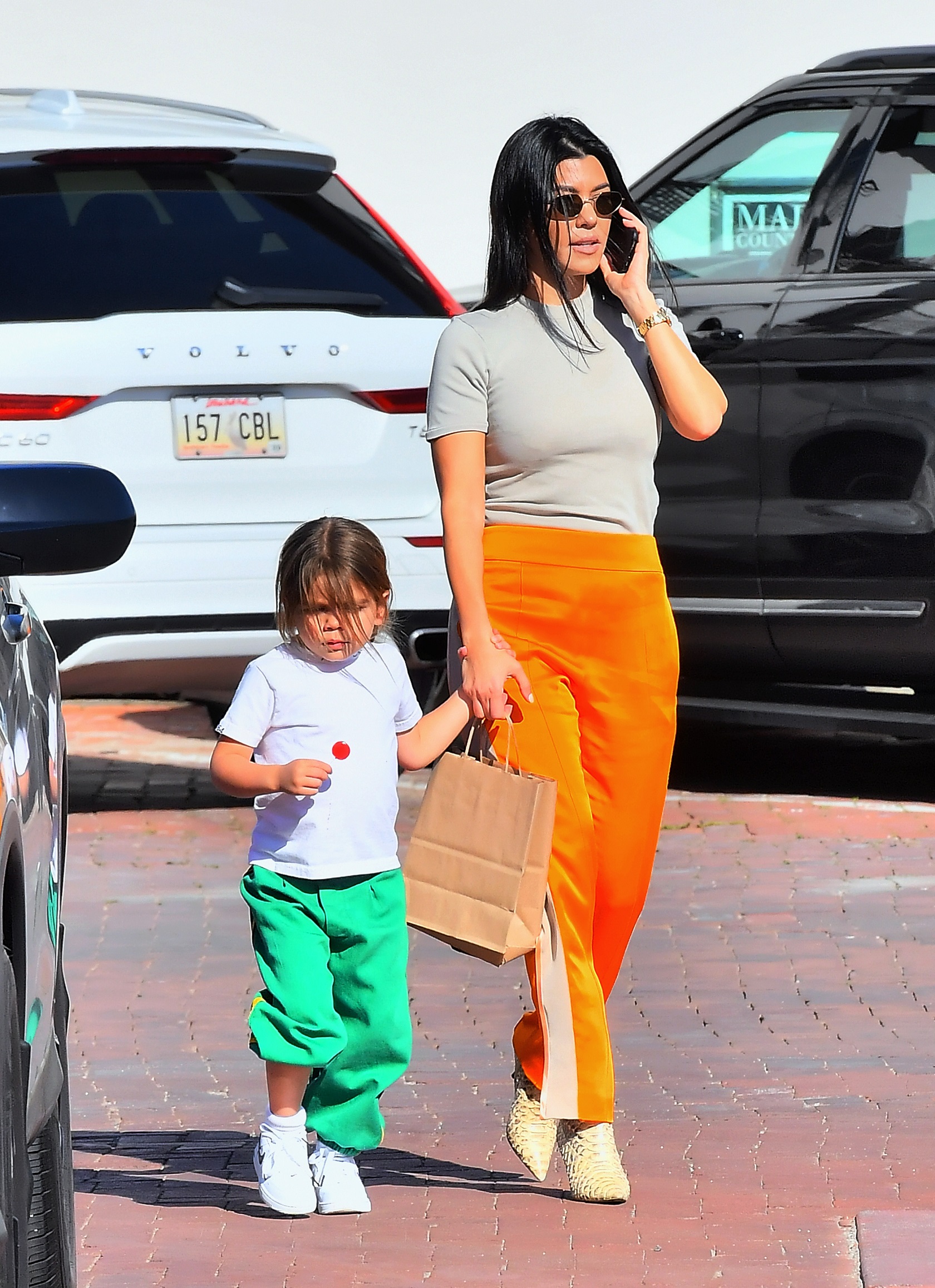 Kourtney Kardashian meets up with ex Scott Disick to drop off daughter Reign in Malibu, CA.