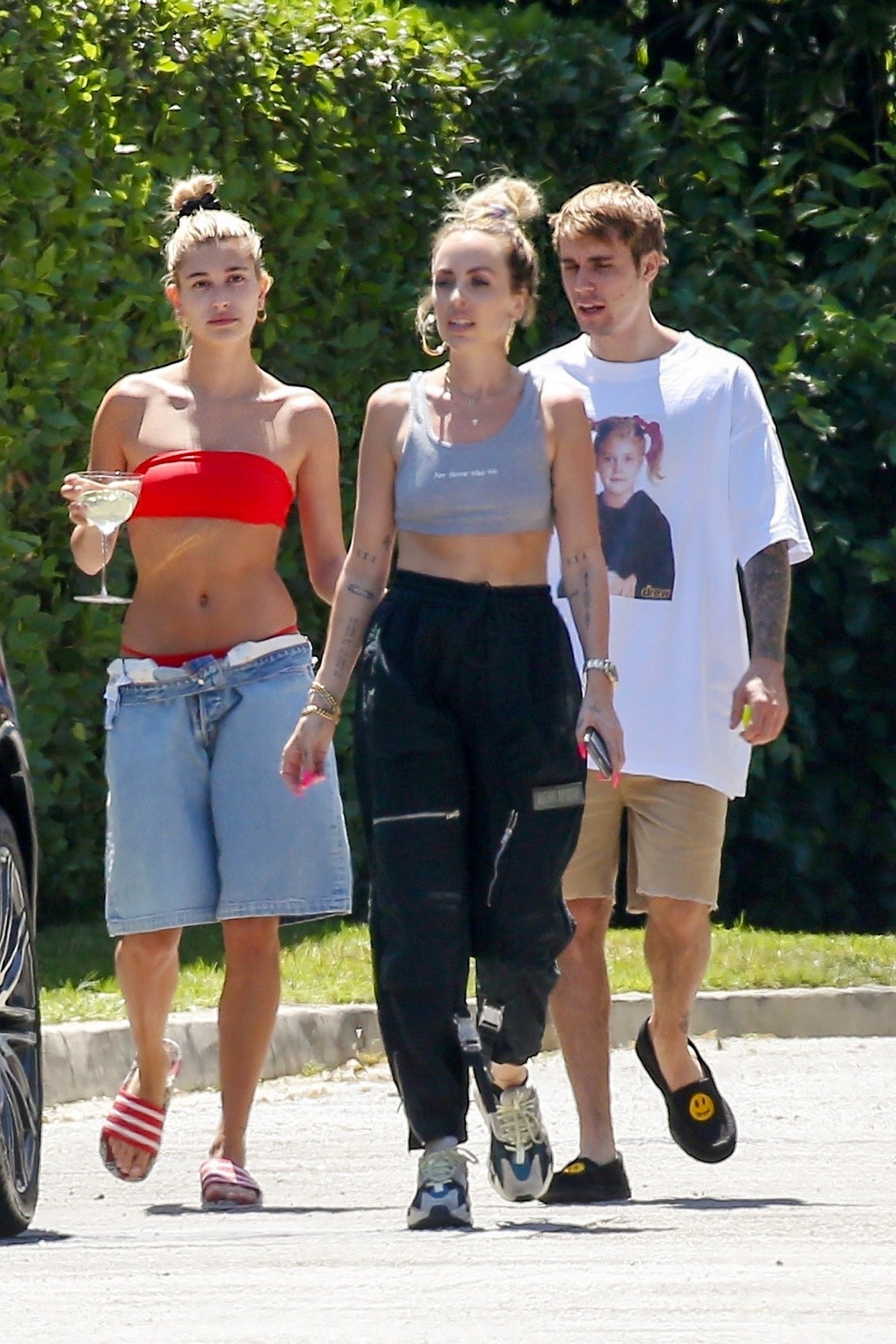 *EXCLUSIVE* It's summertime for the Biebers! Hailey puts her trimmed waist on display while enjoying the heat with hubby Justin
