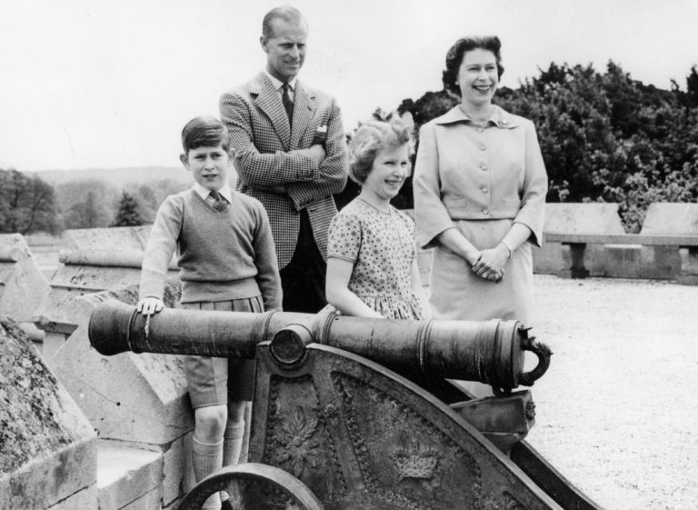 Queen Elizabeth II with her husband Prince Philip and their children on a rooftop Queen Elizabeth II with her husband Prince Philip and their children on a rooftop