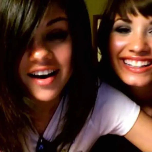 Miley Cyrus and her friend Mandy post a video online, spoofing a clip posted by Demi Lovato and Selena Gomez.