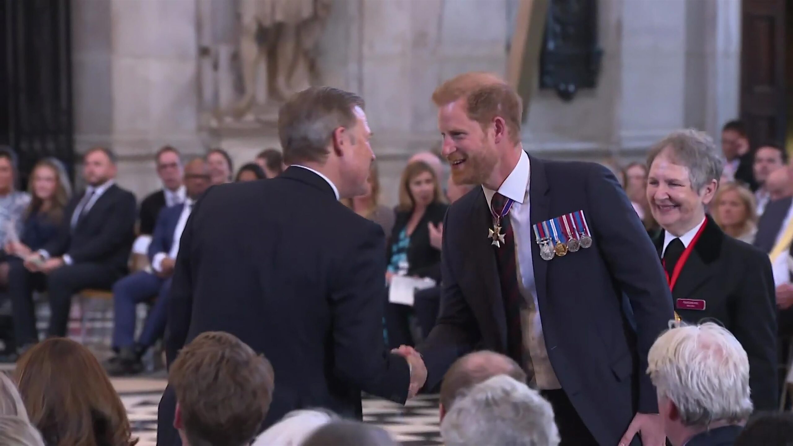 Prince Harry gives a bible reading at a thanksgiving service marking the 10th anniversary of the Invictus Games