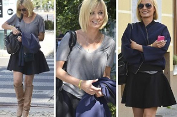 Agnieszka Szulim w czarnej spódnicy i kurtce bomber